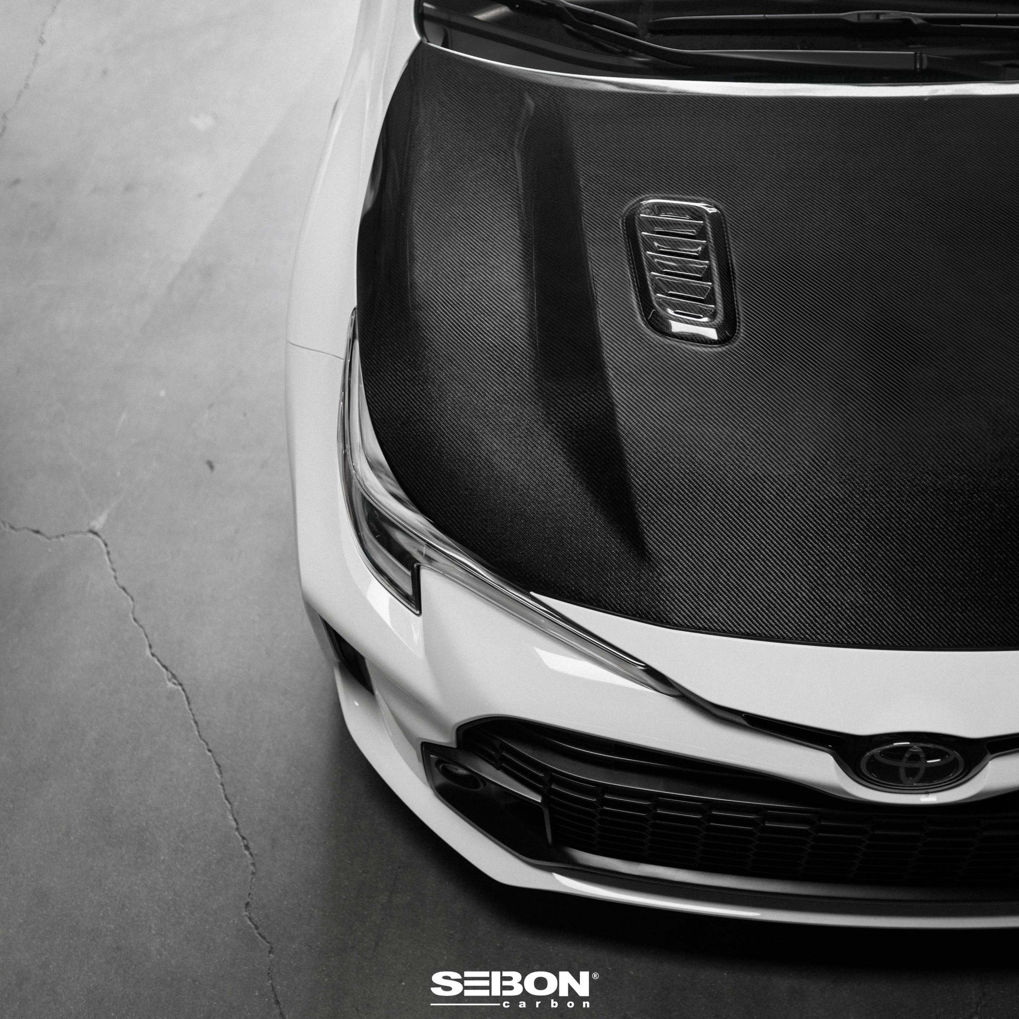 Seibon 2023+ Toyota GR Corolla OE-Style Carbon Fiber Hood - Gloss Finish (HD23TYGRCOR-OE)